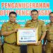 Penerimaan Penghargaan Predikat Kepatuhan Standar Pelayanan Publik Tahun 2022. Selasa (31/01/2023). (Dok. Diskominfo Muaro Jambi)