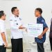 Bupati Muba Toha Serahkan Santunan Jaminan Kematian kepada Ahli Waris Pekerja Rentan