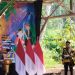 Pj Sekda Jember menghadiri pembukaan Festival Egrang ke-14 di Pasar Lumpur. (Foto: Istimewa)
