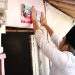 Bupati Jember memasang stiker di rumah warga miskin. (Foto: Dok/Diskominfo Jember)